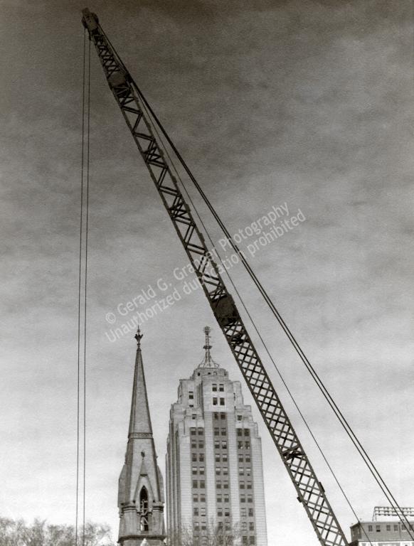 Photo of sky scrapers and a crane