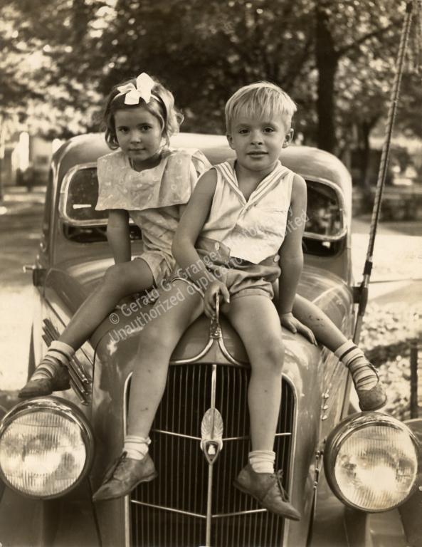 Photo of kids on a car