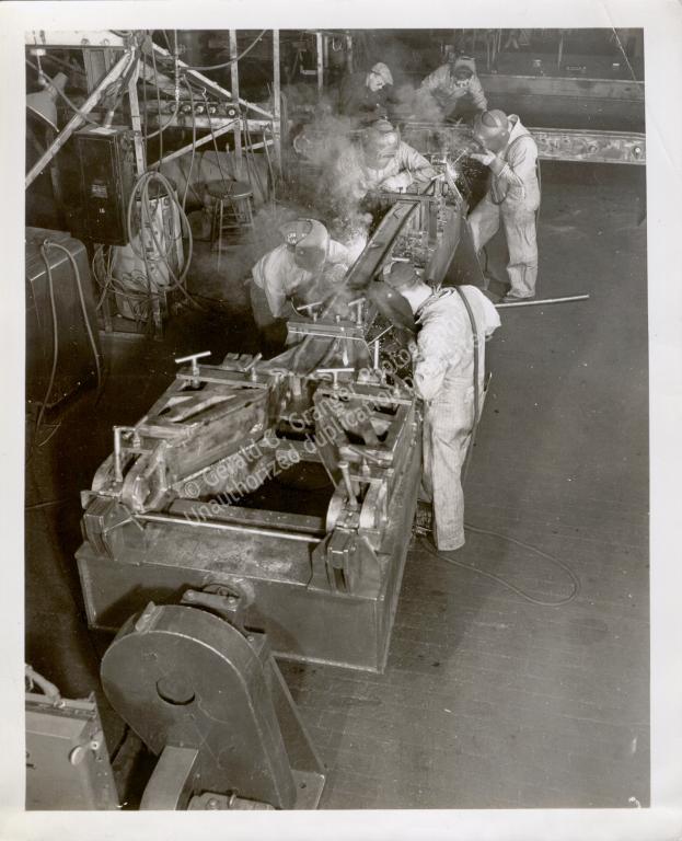 Photo of men working in a factory
